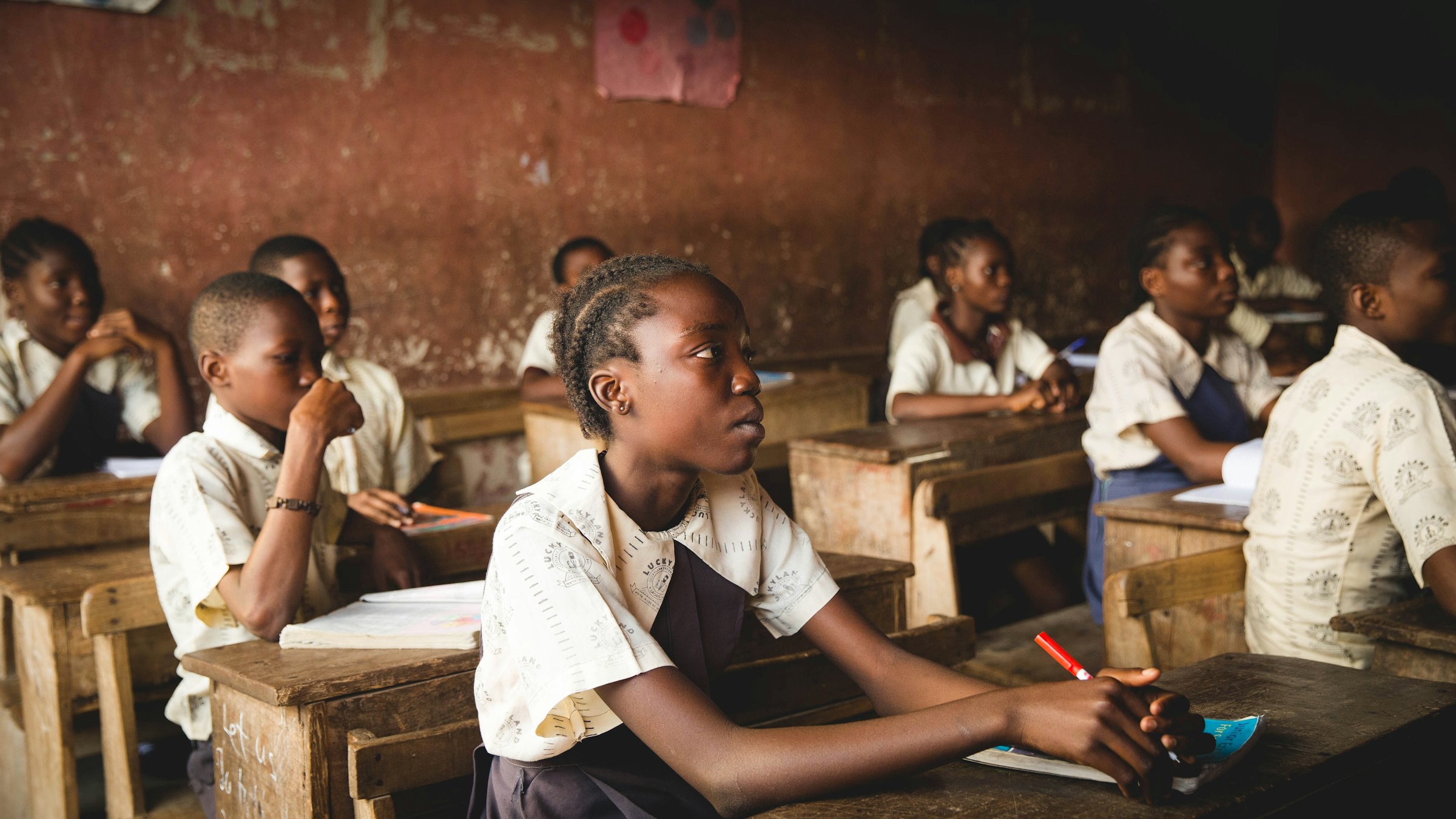 Students seated at desks in a classroom